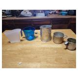 Measuring cups and flour sifter
