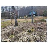 Weather vane with hummingbird, bench with cast