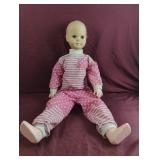 Vintage plastic baby doll with moveable limbs
