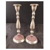 Silver colored candle sticks with red rhinestones