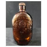 vintage amber glass bottle, likely a Dixie Dew