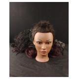Plastic doll head with dress up wigs