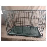 Metal double door dog crate with removable tray.