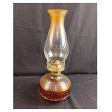 Amber colored oil lamp with globe