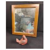 Small mirror and a cardinal figurine