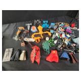 Assorted toy pieces and capes, superhero,  star