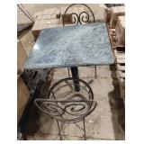 2 metal chairs and a marble table top