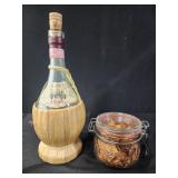 Straw wrapped Chianti wine bottle, glass jar with