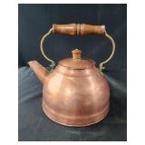 vintage Revere Ware copper tea kettle with a