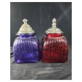 Purple and red glass canisters with lids