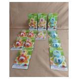 Sesame Street pacifier and holders. 12 total