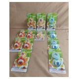 Sesame Street pacifier and holders. 12 total