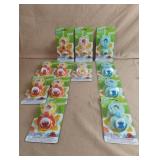 Sesame Street pacifier and holders. 12 total