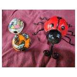 Metal lady bug and 2 beads with designs