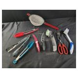 Tongs, strainer, knives, dish brushes