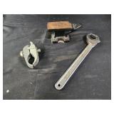 Small cast iron anvil, multi wrench. And clamp
