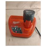Milwaukee M12 battery and charger. Charger powers