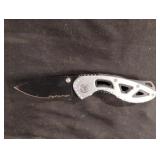 Silver and black pocket knife. Blade is 2.5" long