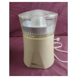 Oster Automatic juicer. Powers on