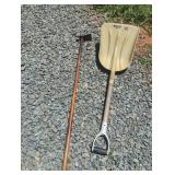Garden hoe and plastic shovel