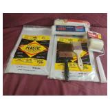 Drop cloths, paint rollers and paint brushes