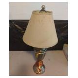 Brass colored lamp. Powers on 22" tall