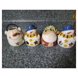 Snowman and santa ceramic candle holders
