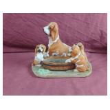 Hound dog with playful puppies