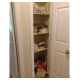 Closet with contents including picture frames,