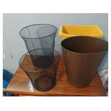 4 small waste baskets. 2 is metal and the 2 are
