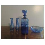 Cobalt blue decanter, vases, bowl and a candle
