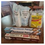 Plastic cups and parchment paper, unopened