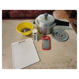 Pressure cooker, cutting board, grater, bowl,