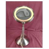 Touch adjustable personal lighted mirror. Works.