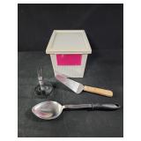 Kitchen tools and a plastic container