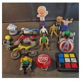 Assorted toys and figures, yo yo, rubiks, bikes
