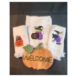 Halloween towels and metal welcome pumpkin