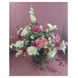 Floral rose arrangement in a green glass vase.