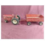 Vintage International metal toy tractor with an
