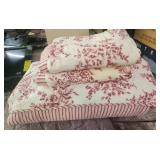 Full bedspread with 2 shams, 1 sham has a stain,