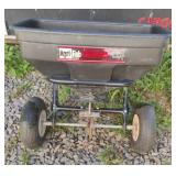 Agri-Fab broadcast spreader 125. Has flat tires