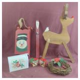 Christmas decor including wood reindeer, small