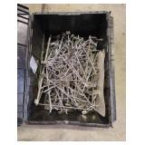 Metal pegs in a tote