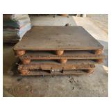 4 wooden pallets show wear