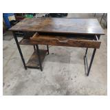 Metal desk with wood top with a power strip 47.5