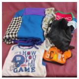 Baby boy clothes with a handmade baby quilt