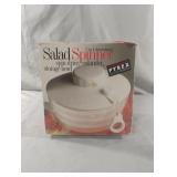 3 I. 1 drawstring salad spinner. Works