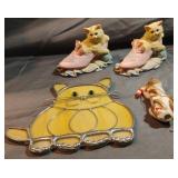 Cat decor. Ceramic cats are in boxes.