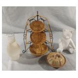 Baskets, ceramic bear, candle and an oil lamp