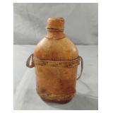 Vintage leather-wrapped glass flask